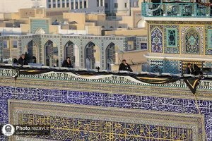 آیین تعویض پرچم گنبد منور رضوی در آستانه ماه محرم