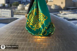 آیین تعویض پرچم حرم امام رضا علیه&zwnj;السلام در آستانه ماه ربیع الاول