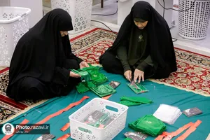 دوخت لباس مراسم شیرخوارگان حسینی در حرم مطهر رضوی