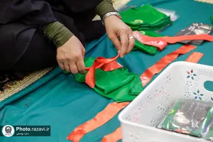 دوخت لباس مراسم شیرخوارگان حسینی در حرم مطهر رضوی