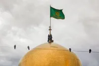 عکس با کیفیت : پرچم گنبد حرم امام رضا علیه السلامآستان نیوز - 