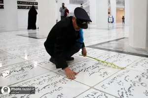 غبارروبی مزار شهدای مدفون در حرم مطهر رضوی