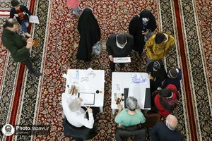 هم&zwnj;نویسی اساتید خوش&zwnj;نویسی ساوجبلاغ در حرم مطهر رضوی