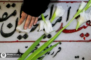 غبارروبی مزار شهدای مدفون در حرم مطهر رضوی