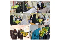 حضور خادمان بارگاه منور رضوی همراه با پرچم متبرک در بیمارستان رضوی