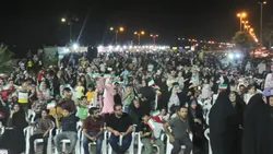 اهتزاز پرچم متبرک رضوی بر بلندای ساحل نیلگون خلیج فارس