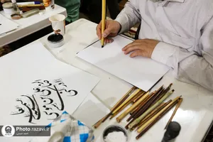 هم&zwnj;نویسی اساتید خوش&zwnj;نویسی ساوجبلاغ در حرم مطهر رضوی
