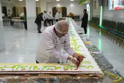پخت کیک 88متری به مناسبت جشن میلاد امام جواد(ع) در مهمانسرای حضرتی