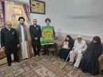 خادمان حرم رضوی با خانواده شهید اسماعیل جمیله دیدار کردند 